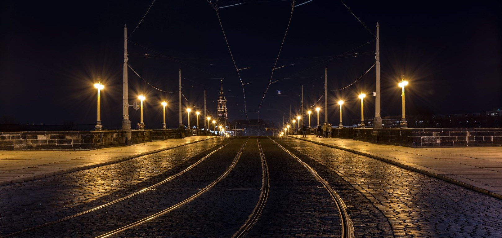 Photo of street lights on both sides of a dark street